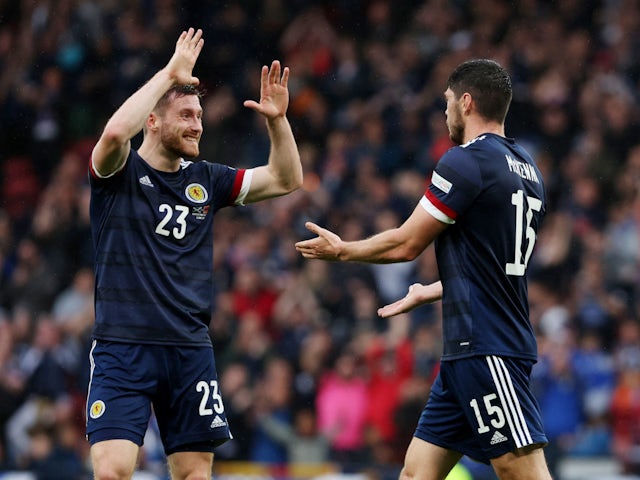 Scott McKenna and Anthony Ralston celebrate scoring for Scotland against Armenia on June 8, 2022.
