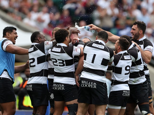 Barbarians celebrating a try during their victory over England on June 19, 2022.