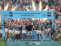 Leicester Tigers's Freddie Burns and teammates celebrate with the trophy after winning the Premiership Play-Off Final on June 18, 2022