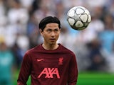 Takumi Minamino warms up for Liverpool in May 2022