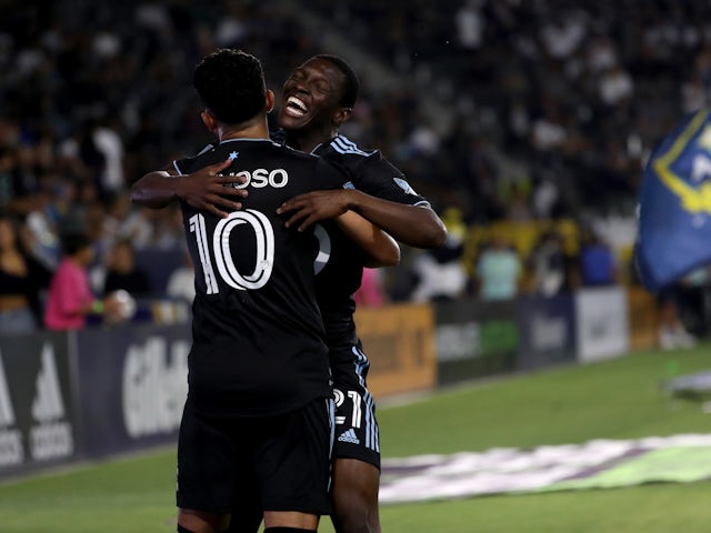 Minnesota United FC midfielder Emanuel Reynoso (10) celebrates with forward Bongokuhle Hlongwane (21) after scoring a goal during the first half against the Los Angeles Galaxy at Dignity Health Sports Park on June 29, 2022