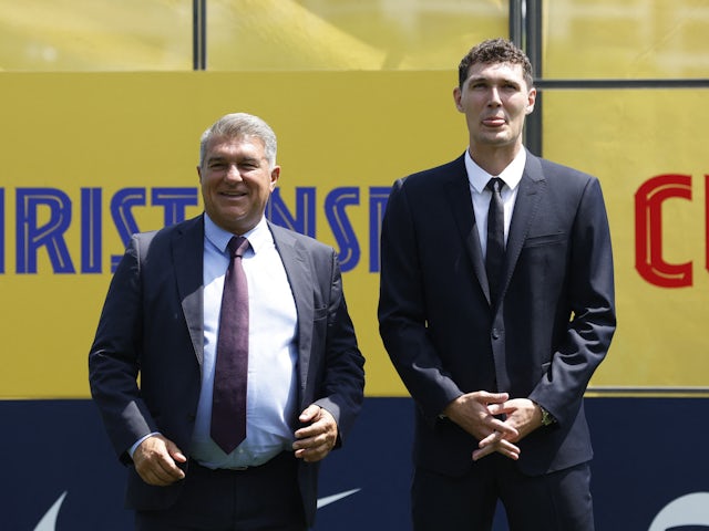 Barcelona defender Andreas Christensen and president Joan Laporta pictured on July 7, 2022