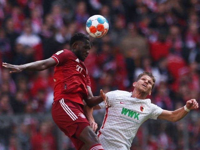 Bayern Munich's Omar Richards in action with FC Augsburg's Florian Niederlechner on April 9, 2022