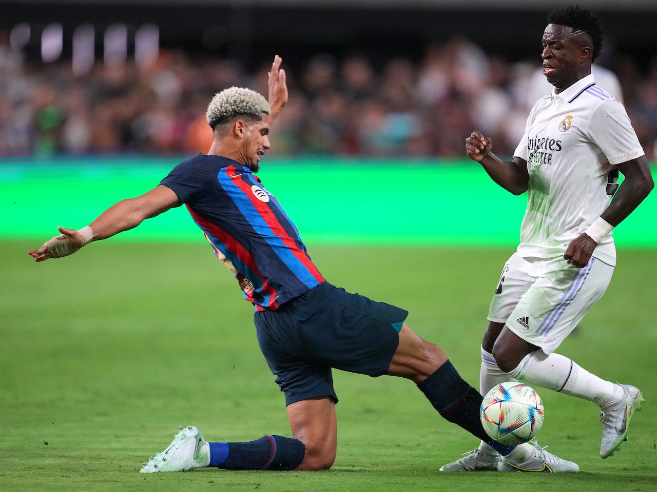 Real Madrid's Vinicius Junior in action with Barcelona's Ronald Araujo on  July 23, 2022 - Sports Mole