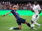 Real Madrid's Vinicius Junior in action with Barcelona's Ronald Araujo on July 23, 2022