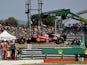 The Ferrari of Charles Leclerc is lifted away after a crash at the French Grand Prix on July 24, 2022.