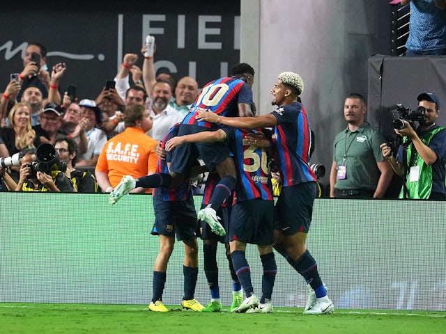 Barcelona attacker Raphinha celebrates scoring against Real Madrid on July 23, 2022