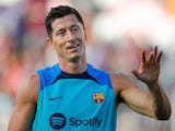 Barcelona's Robert Lewandowski reacts towards the fans during a training session on Jul 19, 2022