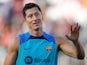 Barcelona's Robert Lewandowski reacts towards the fans during a training session on Jul 19, 2022