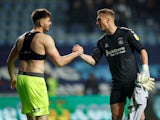 Birmingham City's Matija Sarkic shakes hands with Coventry City's Simon Moore after the match on November 23, 2021
