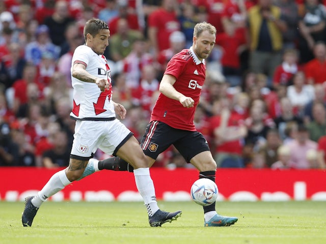 Manchester United's Christian Eriksen in action with Rayo Vallecano's Oscar Trejo on July 31, 2022
