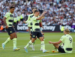 Manchester City's Erling Braut Haaland celebrates scoring their first goal with Phil Foden and teammates on August 7, 2022
