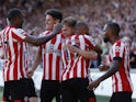 Brentford celebrate scoring against Manchester United in their Premier League fixture on August 13, 2022.