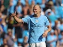 Manchester City's Erling Braut Haaland greets his fans on August 13, 2022