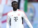 Tanguy Nianzou warms up for Bayern Munich in July 2022