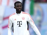 Tanguy Nianzou warms up for Bayern Munich in July 2022