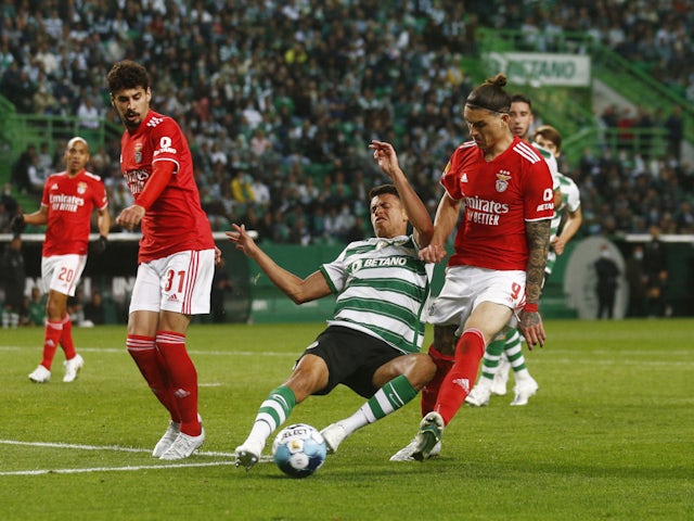 Sporting Lisbon midfielder Matheus Nunes tackling Benfica forward Darwin Nunez in April 2022.