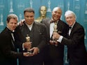 Muhammad Ali and George Foreman receiving an award for 'The Rumble In The Jungle' in 1997.