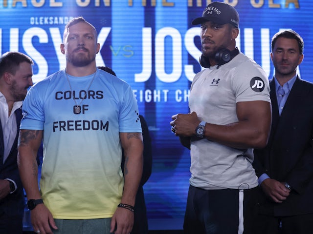 Oleksandr Usyk and Anthony Joshua at a press conference in June 2022.