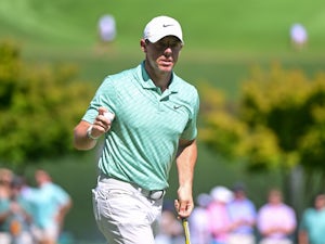 McIlroy edges out Reed to win Dubai Desert Classic