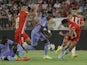 Real Madrid's Vinicius Junior in action with Almeria's Kaiky on August 14, 2022