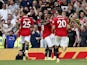 Manchester United's Marcus Rashford celebrates scoring their second goal with Bruno Fernandes and teammates on September 4, 2022