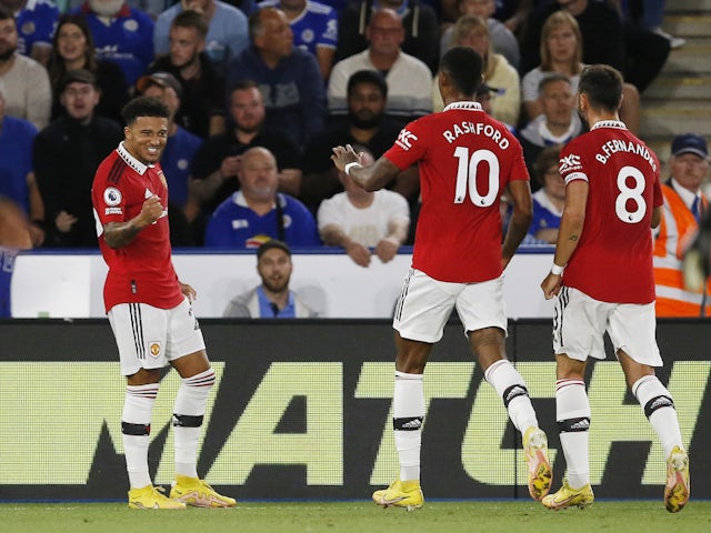 Manchester United's Jadon Sancho celebrates scoring their first goal with Marcus Rashford and Bruno Fernandes on September 1, 2022