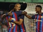FC Barcelona's Pierre-Emerick Aubameyang celebrates scoring their fifth goal with Franck Kessie and Ansu Fati in August 2022