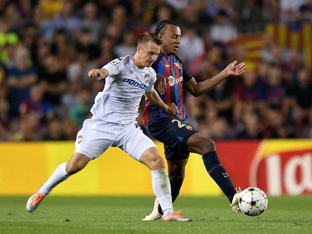 Barcelona's Jules Kounde in action with Viktoria Plzen's Jan Sykora in the Champions League on September 7, 2022