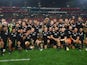 New Zealand players celebrate with the Freedom Cup trophy after winning the match in August 2022