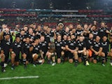 New Zealand players celebrate with the Freedom Cup trophy after winning the match in August 2022