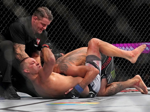 Nate Diaz (red gloves) fights Tony Ferguson (blue gloves) during UFC 279 at T-Mobile Arena on September 10, 2022