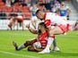 St Helens' Alex Walmsley celebrates scoring their try in June 2022