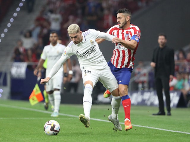 Federico Valverde of Real Madrid in action with Koke of Atletico Madrid on September 18, 2022