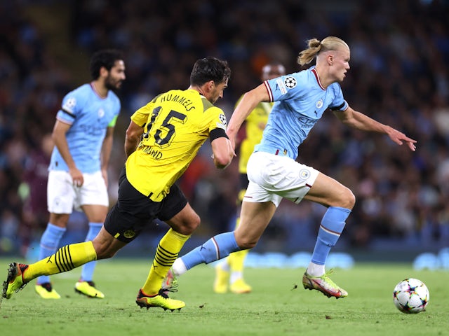 Manchester City's Erling Braut Haaland in action with Borussia Dortmund's Mats Hummels on September 14, 2022