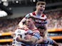 Wigan Warriors' Jai Field celebrates scoring their second try with teammates in May 2022
