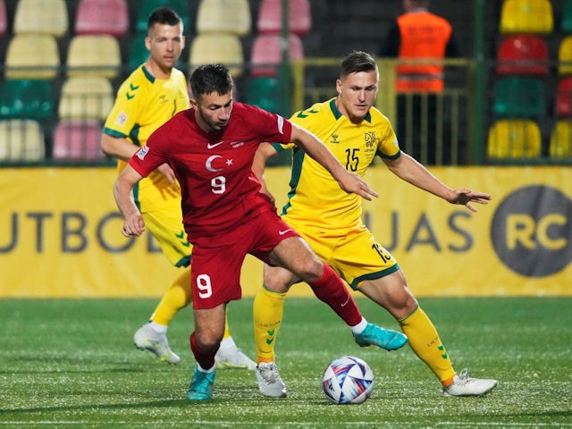 Turkey's Halil Dervisoglu in action with Lithuania's Linas Megelaitis on June 7, 2022