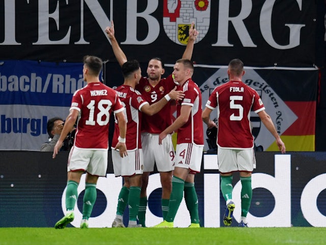 Hungary's Adam Szalai celebrates scoring their first goal with teammates on September 23, 2022