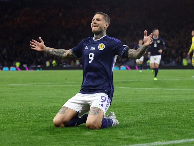 Lyndon Dykes celebrates scoring for Scotland on September 21, 2022