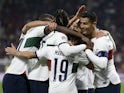 Portugal's Diogo Dalot celebrates scoring their third goal with teammates on September 24, 2022
