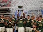 South Africa's Siya Kolisi lifts the trophy as he celebrates with teammates after winning the match against Argentina on September 17, 2022