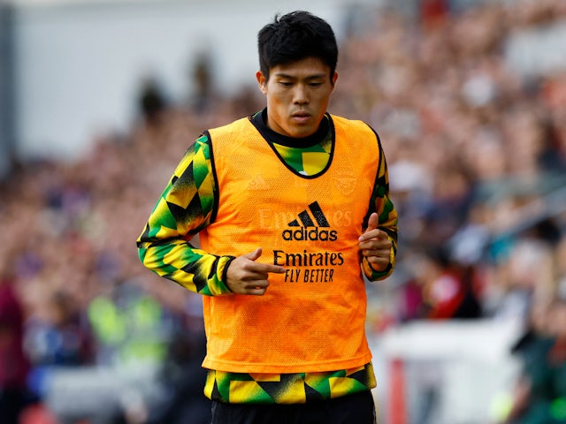 Takehiro Tomiyasu warms up for Arsenal in September 2022
