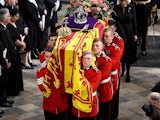 Pallbearers carry The Queen's coffin on September 19, 2022