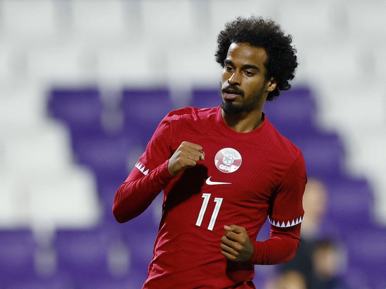 Akram Afif celebrates scoring for Qatar on September 27, 2022 - Sports Mole