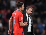 England's Harry Maguire shakes hands with manager Gareth Southgate after the match on September 26, 2022