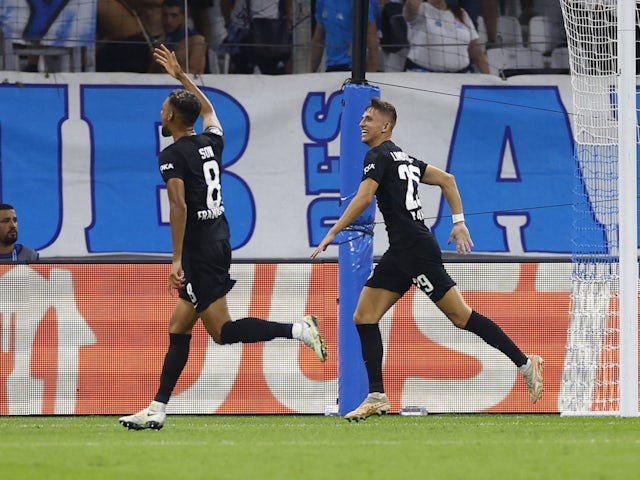 Eintracht Frankfurt's Jesper Lindstrom celebrates scoring their first goal with Djibril Sow on September 13, 2022