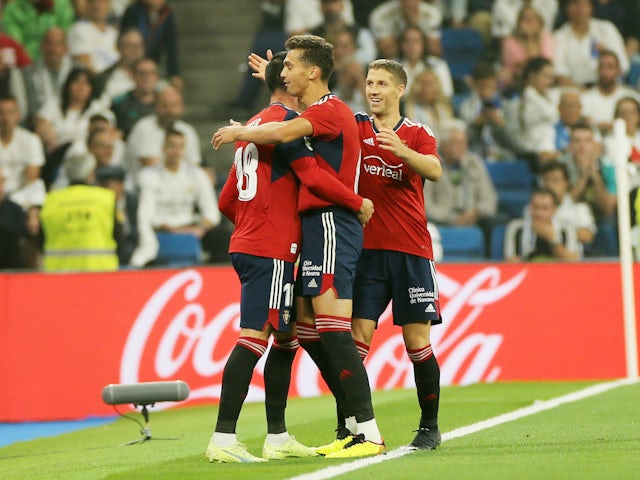 Osasuna's Kike Garcia celebrates scoring their first goal with teammates on October 2, 2022