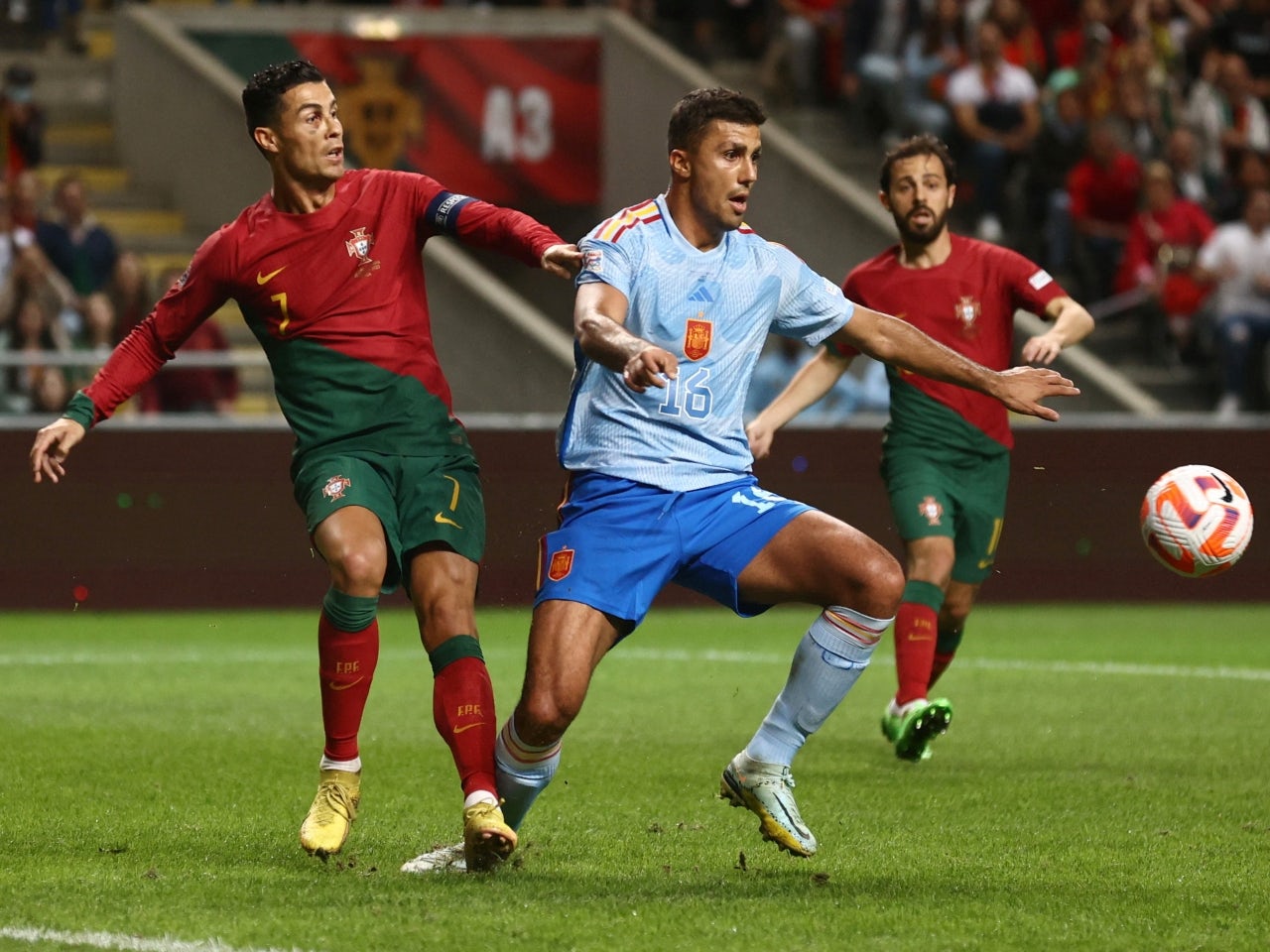 Spain's Rodri in action with Portugal's Cristiano Ronaldo on September 27, 2022