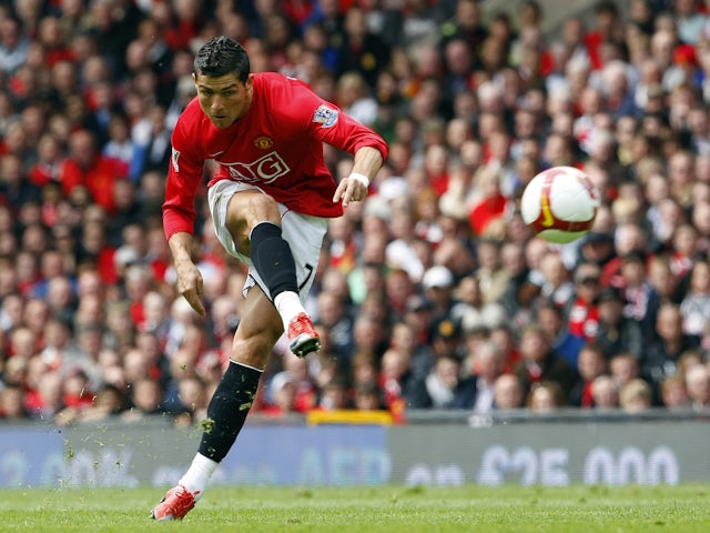 Manchester United's Cristiano Ronaldo shoots at goal during their English Premier League soccer match against Manchester City in Manchester, northern England, May 10, 2009