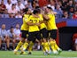 Borussia Dortmund's Raphael Guerreiro celebrates scoring against Sevilla on October 5, 2022